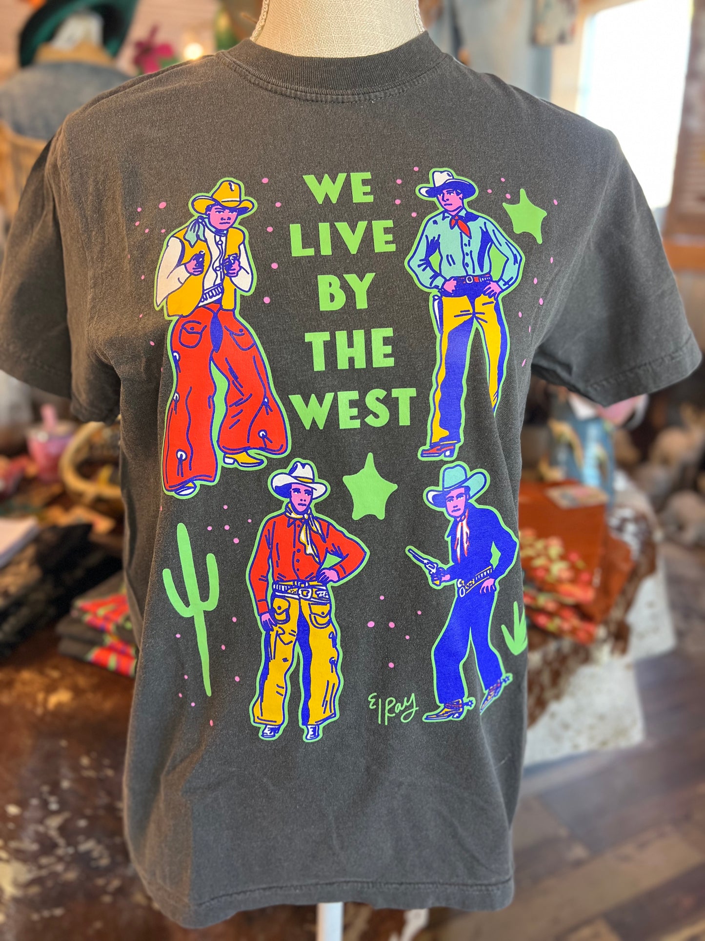 We live by the West Tee