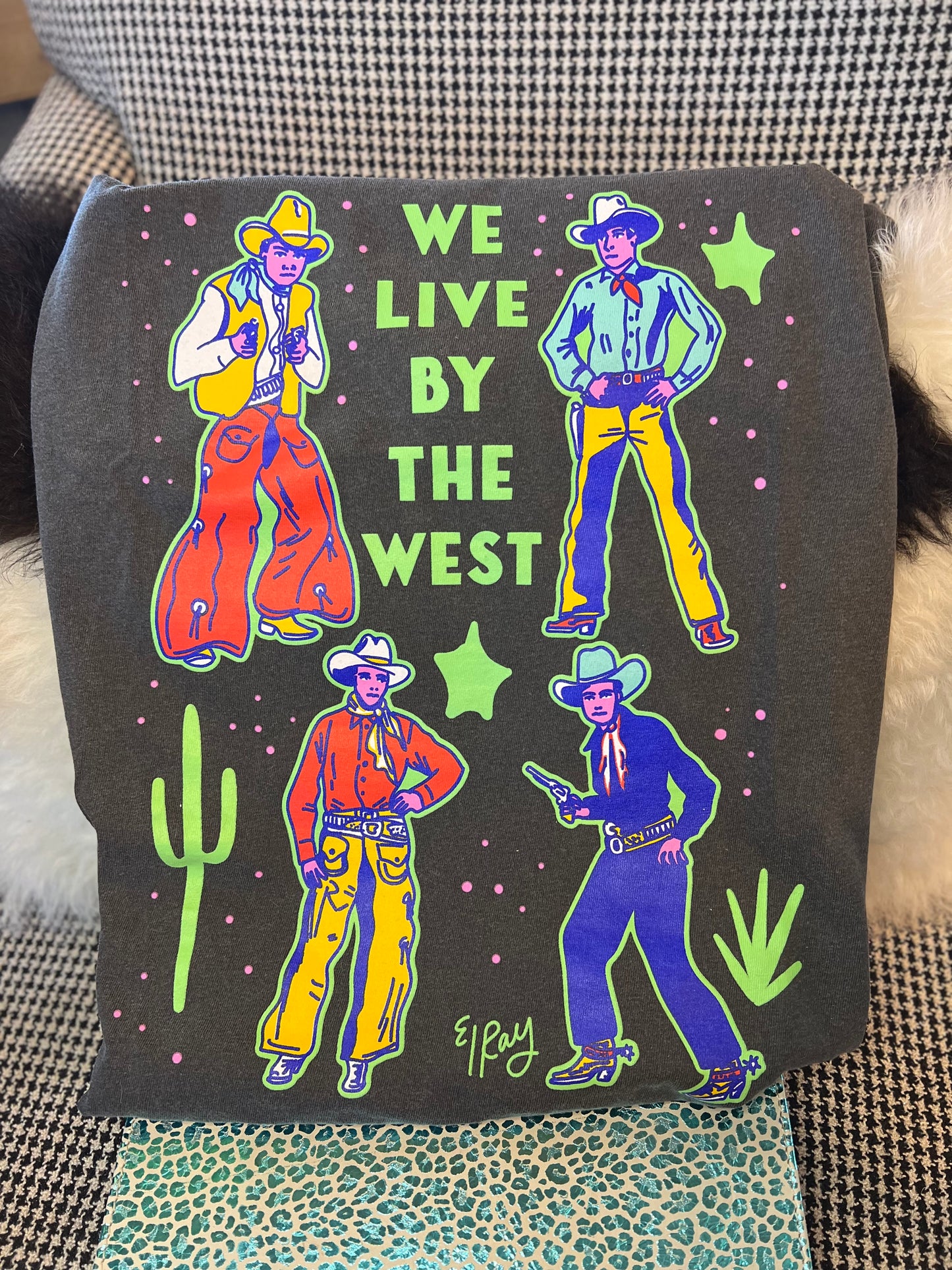We live by the West Tee